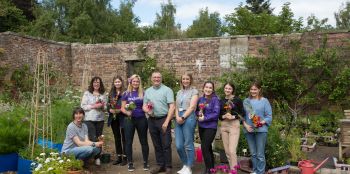 Swapping laptops for plant pots during SAMH project visit